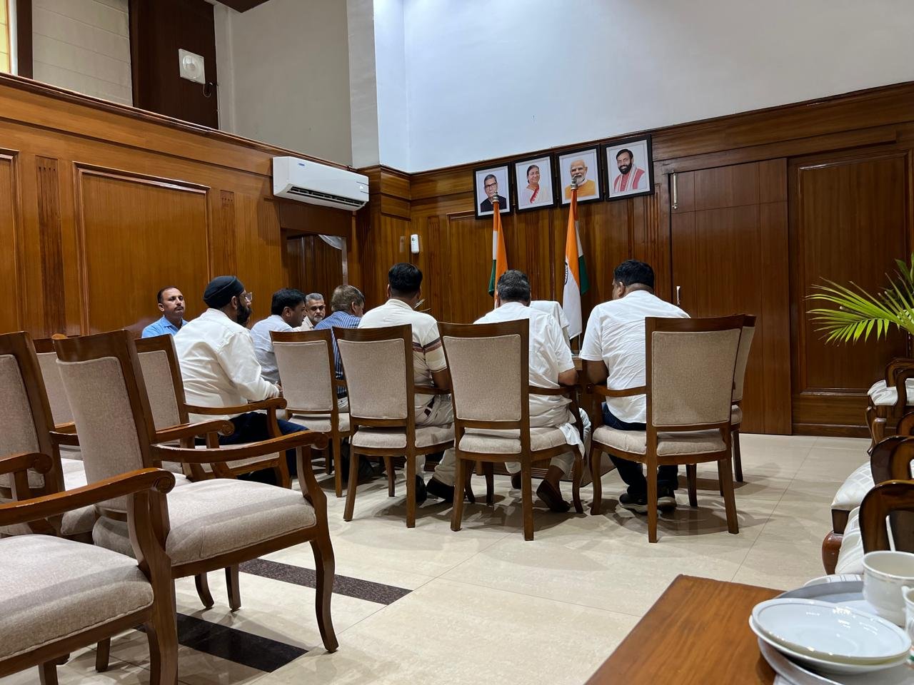 Another view of the meeting room as officials gather ahead of the discussion