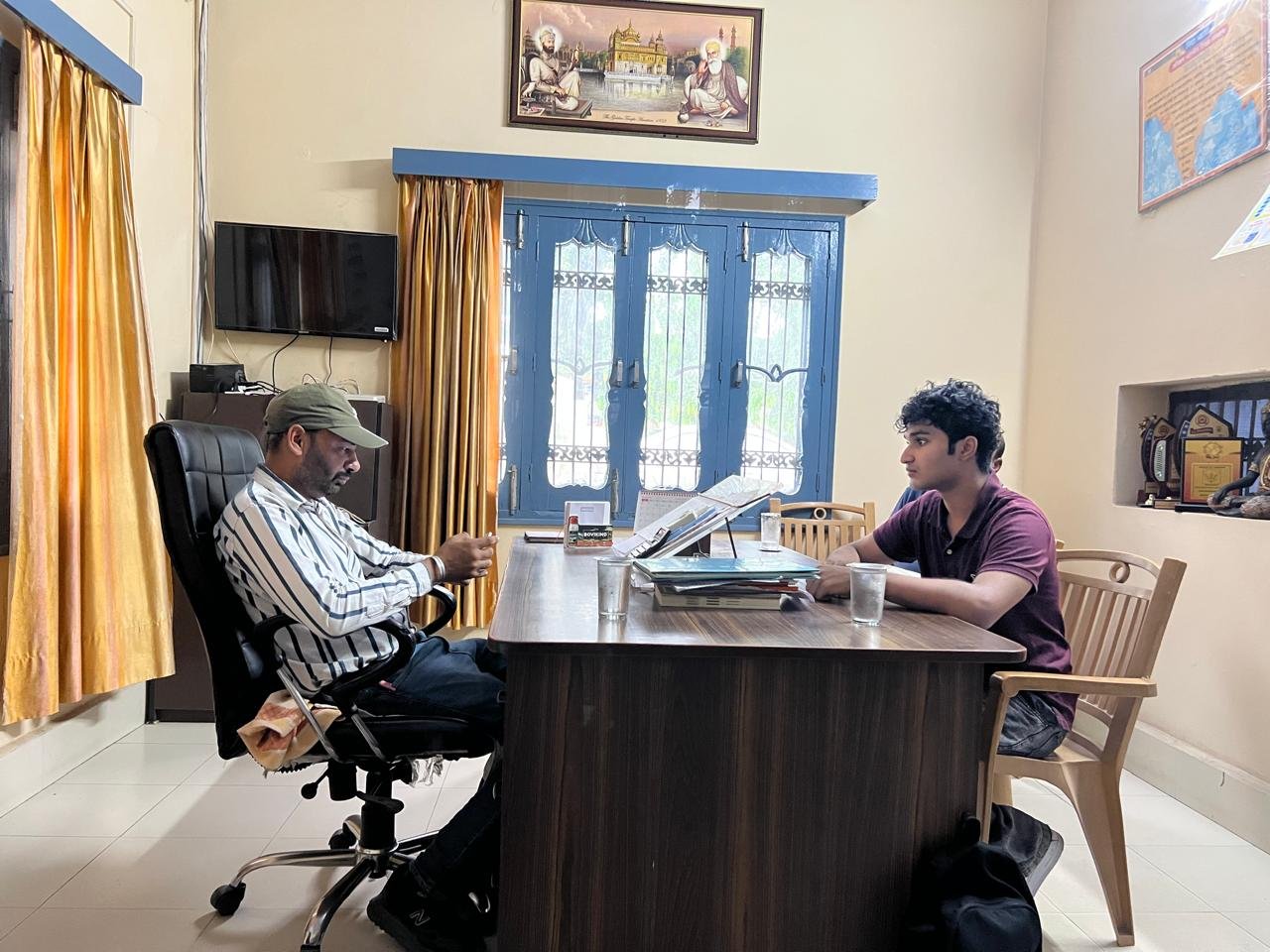 In discussion with the school's principal in his office ahead of the awareness sessions