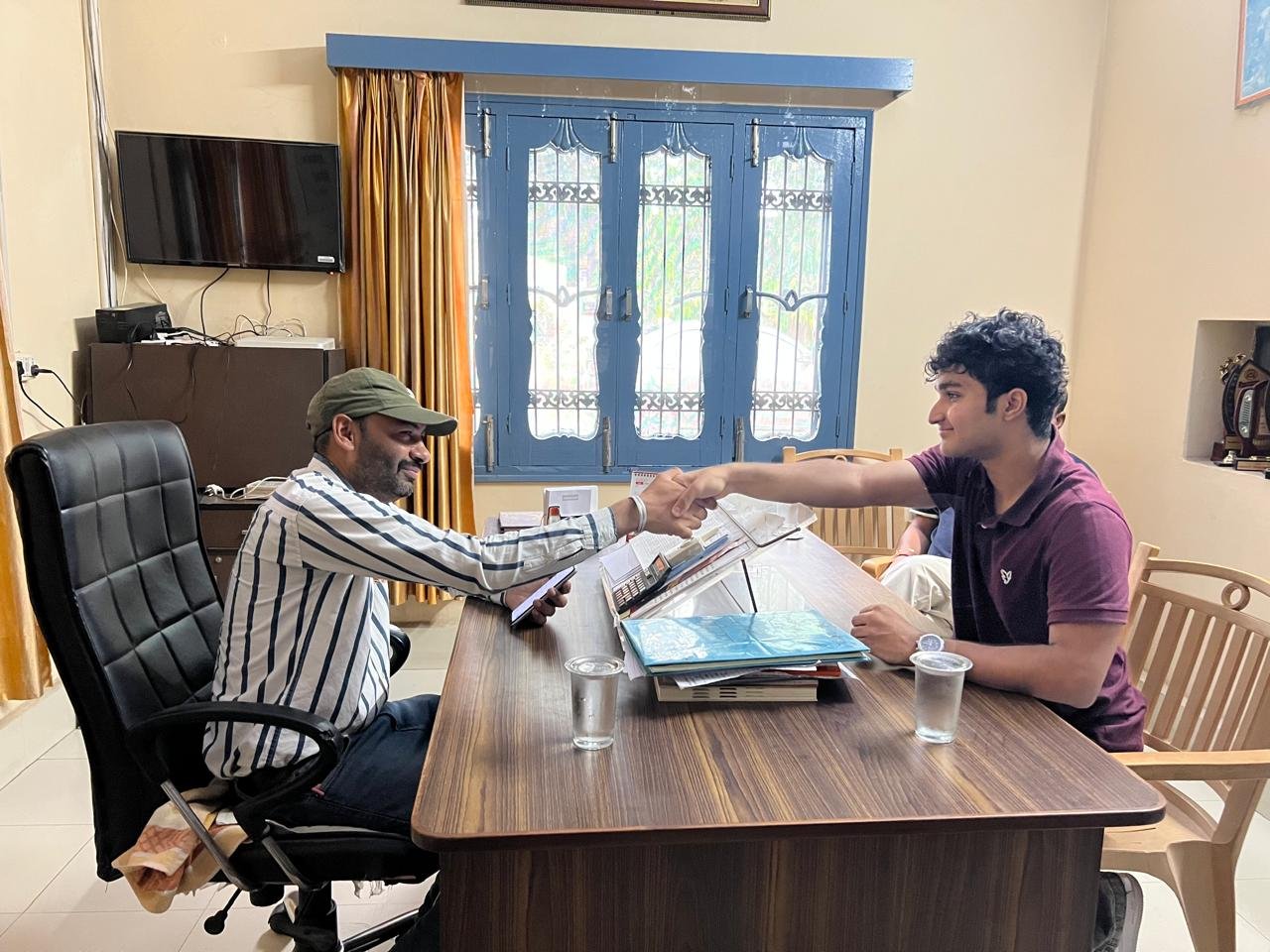 Shaking hands with the principal after planning the partnership